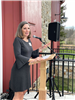 Sandy D'Amico speaks to the crowd at Barn ribbon cutting