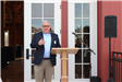 Tony Scheivert speaks to the crowd at Barn ribbon cutting