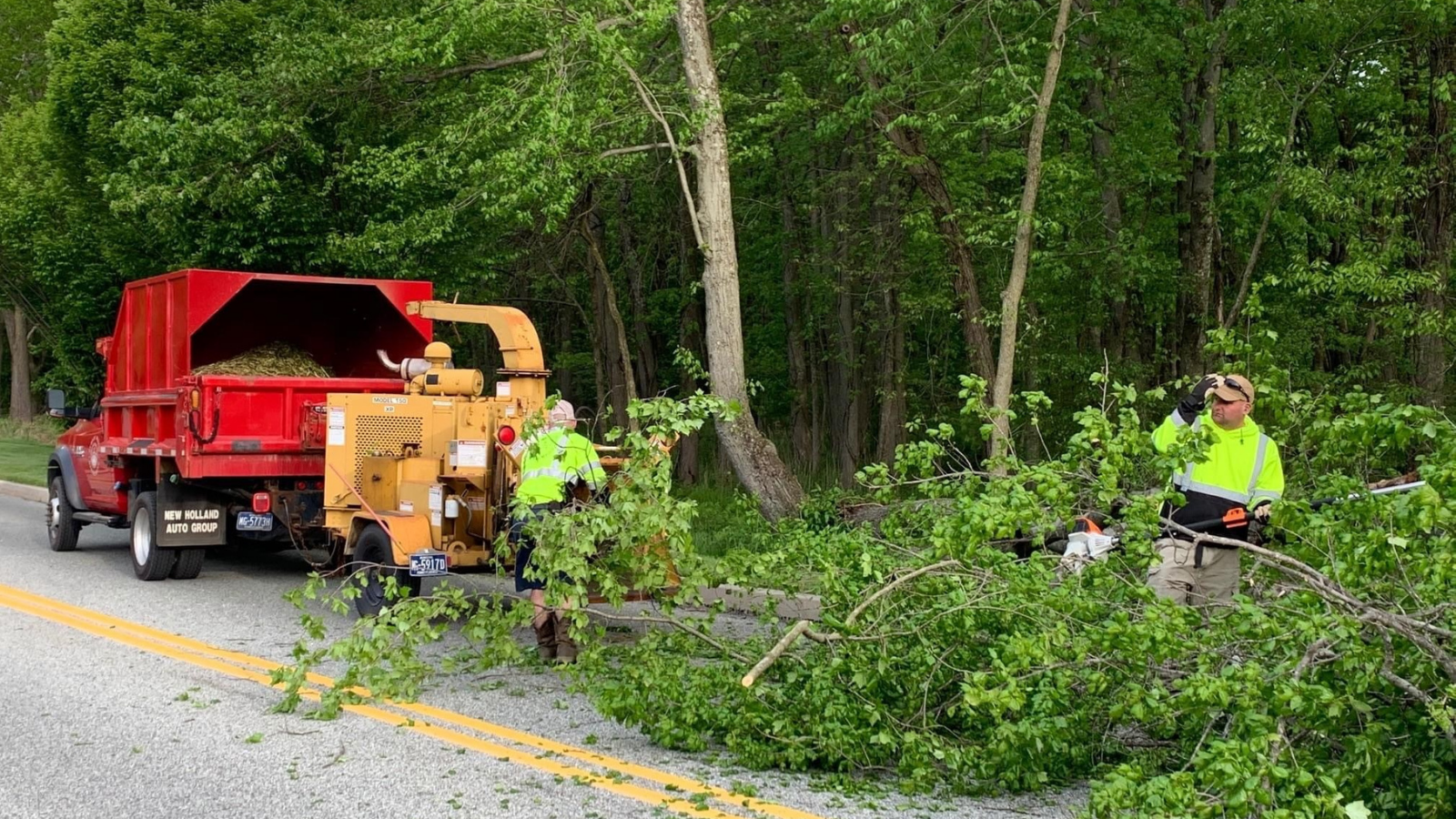 Image of Public Works crew clearing tree from road