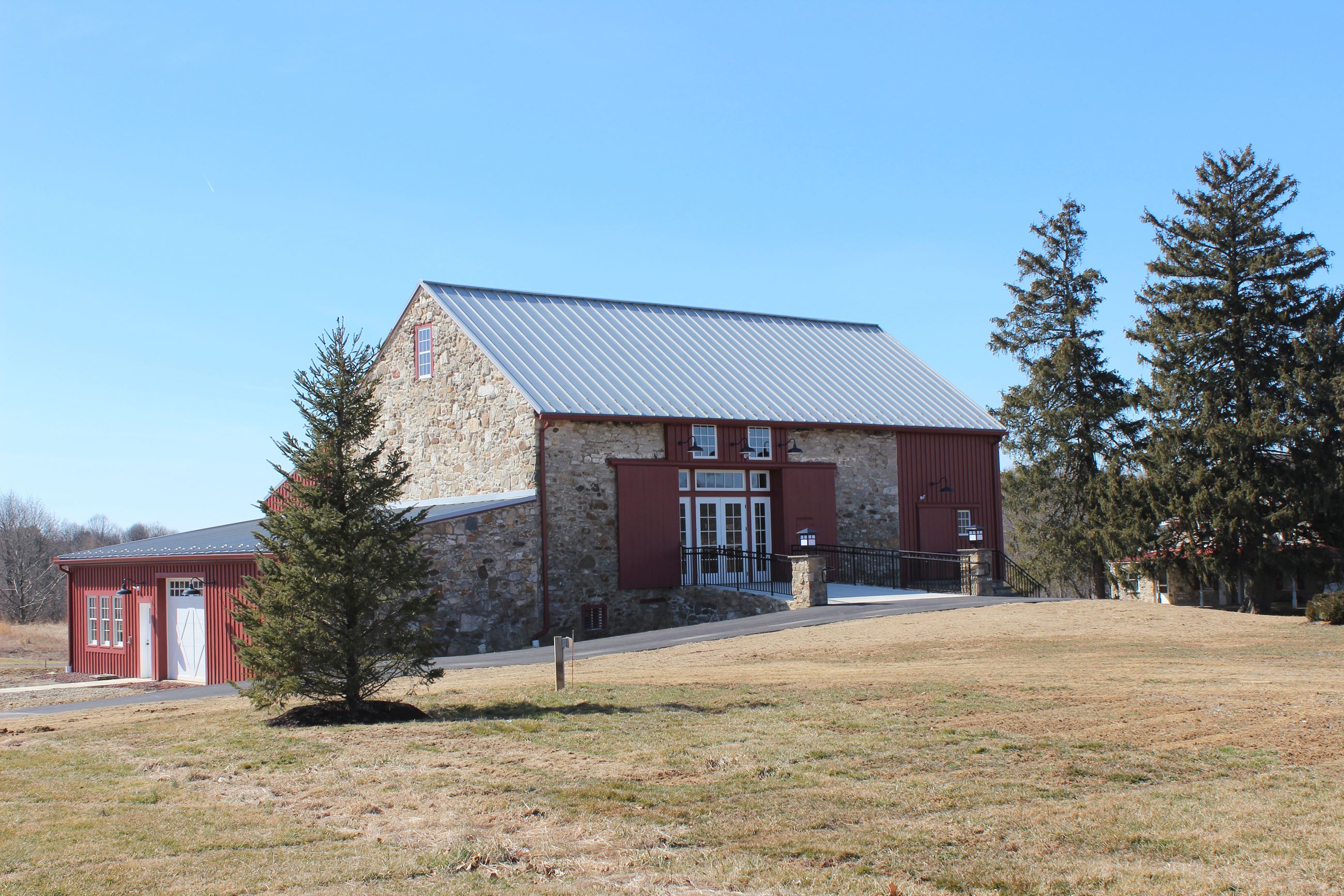 Front of Upland Barn with Christmas Tree in the foreground